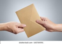 hand-giving-brown-envelope-on-260nw-1437359591.jpg