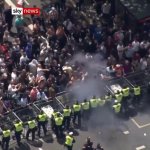Racist louts attack police with smoke bombs.jpg